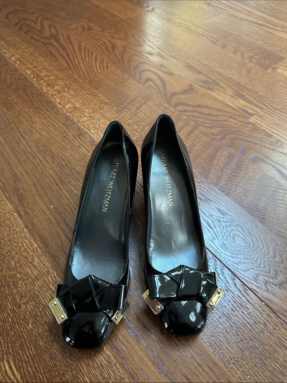 Stuart Weitzman Black Patent Leather Bow Flats with Gold Accents